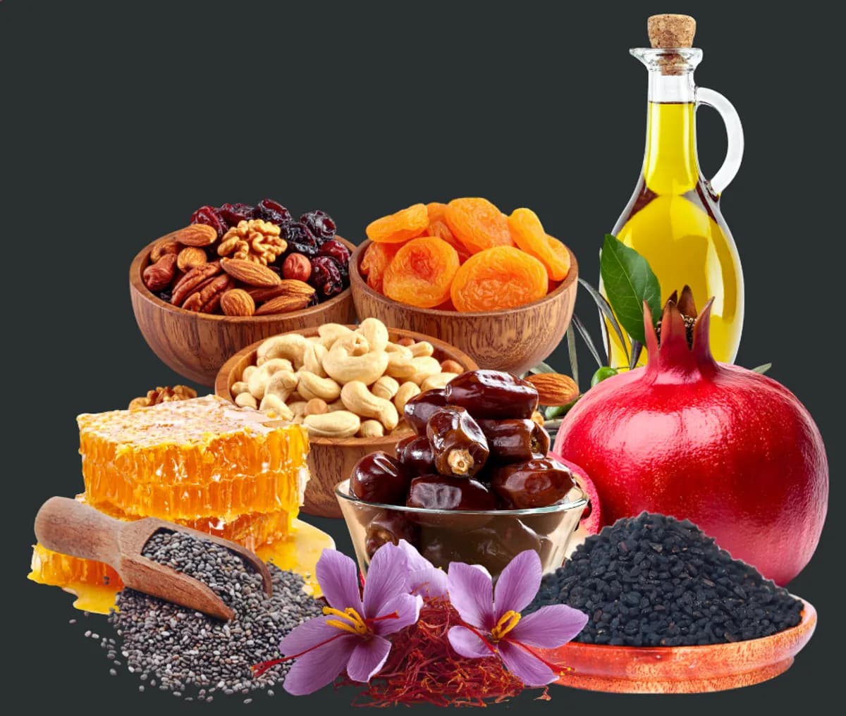 Dates, nuts, dried fruit, honey and olive oil in wooden bowls