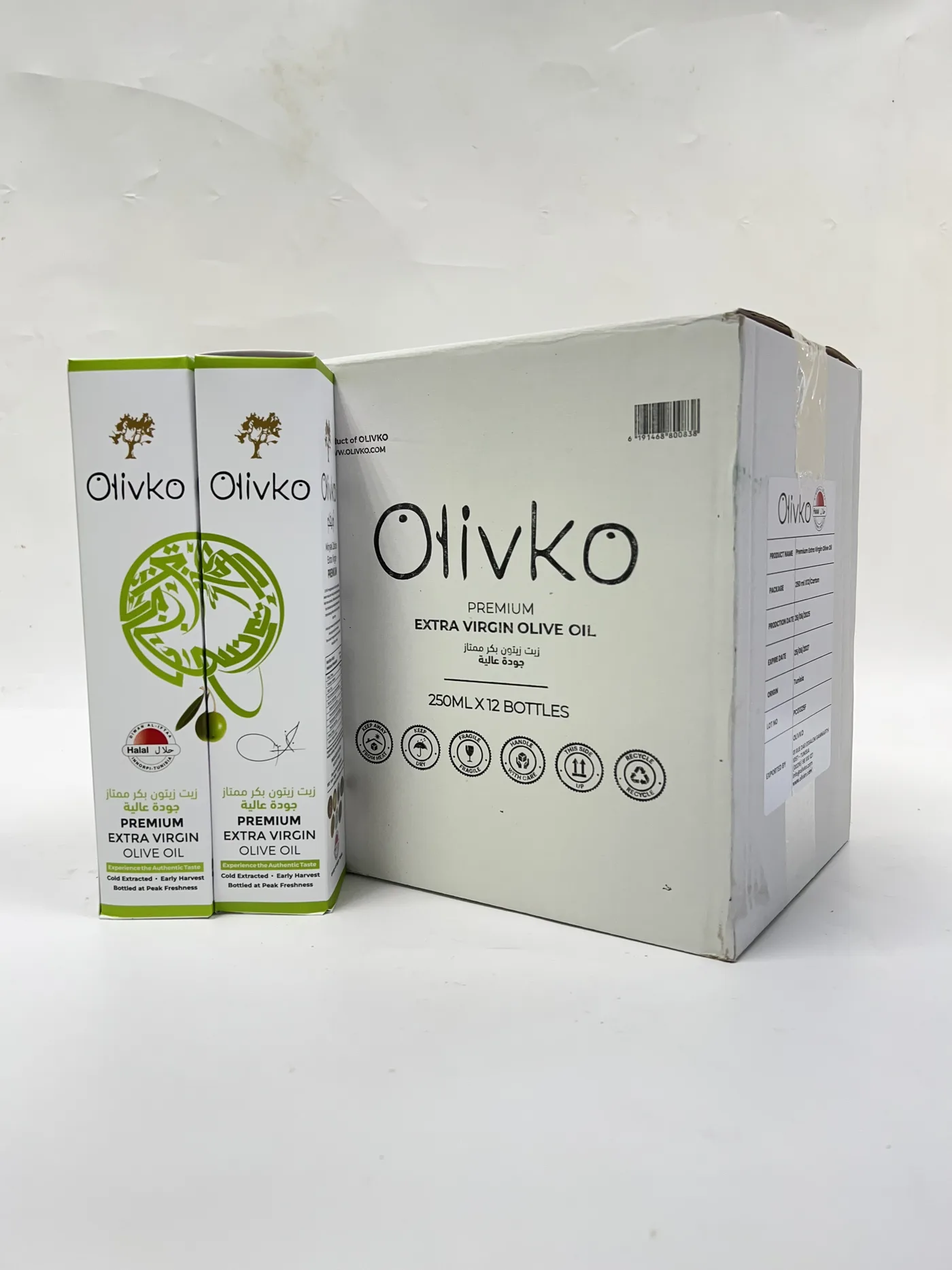 Kotak Olivko Minyak Zaitun Extra Virgin Premium 250ml di sebelah karton 12 botol